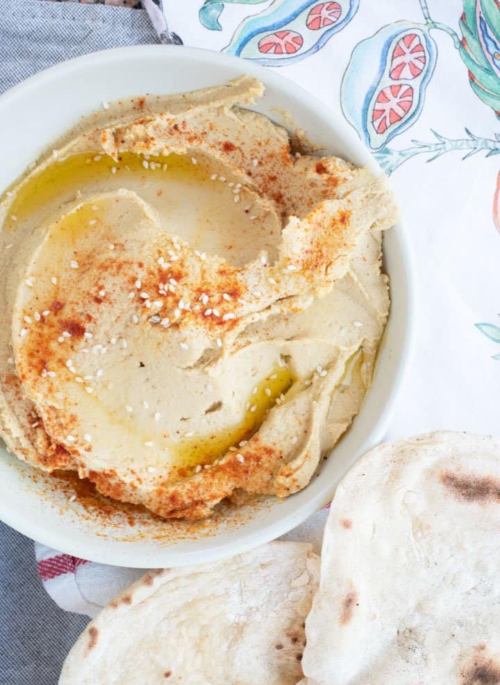 Hummus topped with sesame seeds and smoked paprika. 