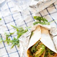 Halloumi and avocado wrap wrapped in foil.
