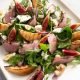 Plate of colourful smoked duck and grilled pear salad.