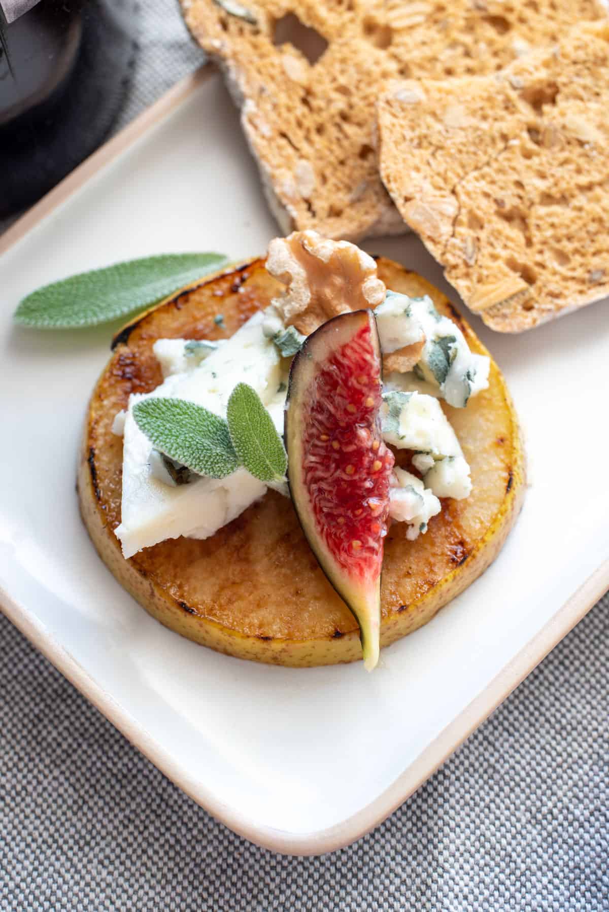 grilled pear appetiser with blue cheese and fig.