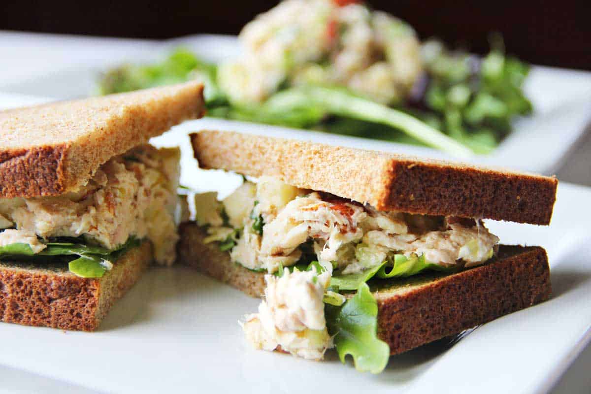 Tuna salad sandwich on a plate. 