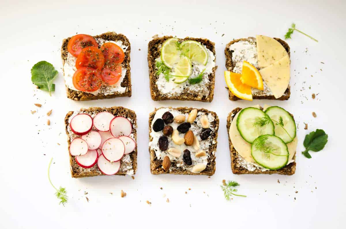 6 brightly arranged open sandwiches in rows.
