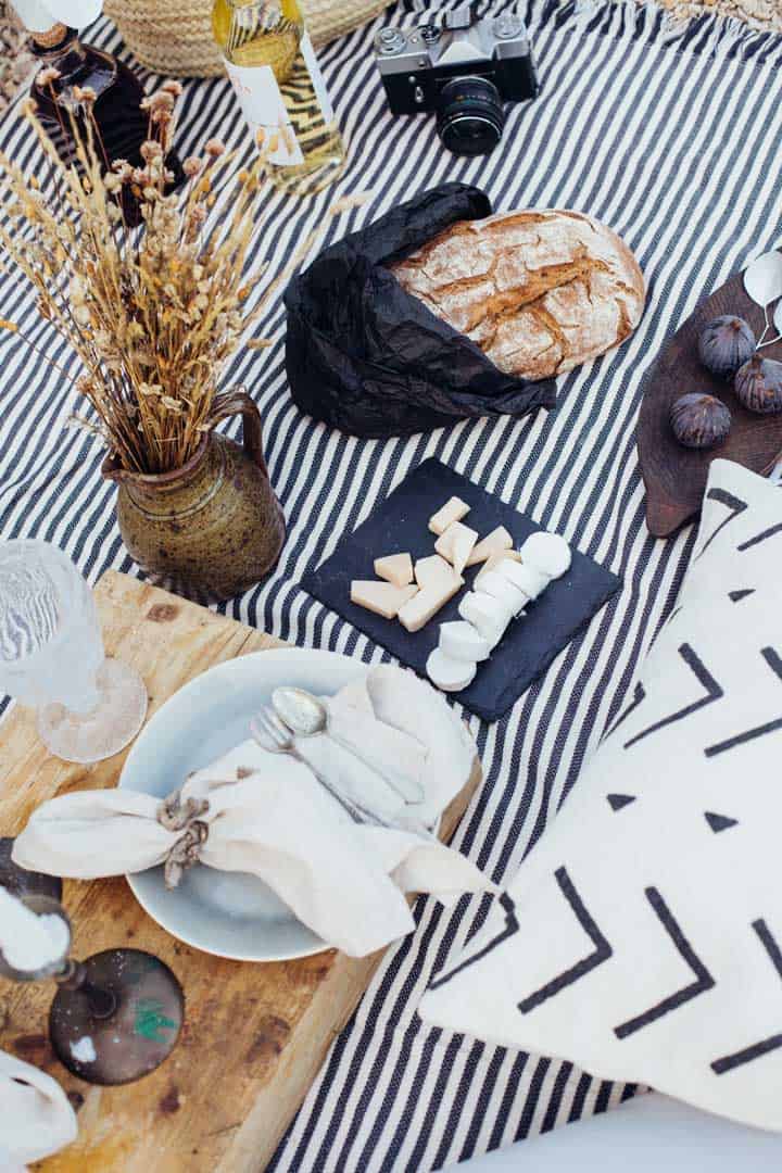 Picnic layout with cheese and rustic bread.