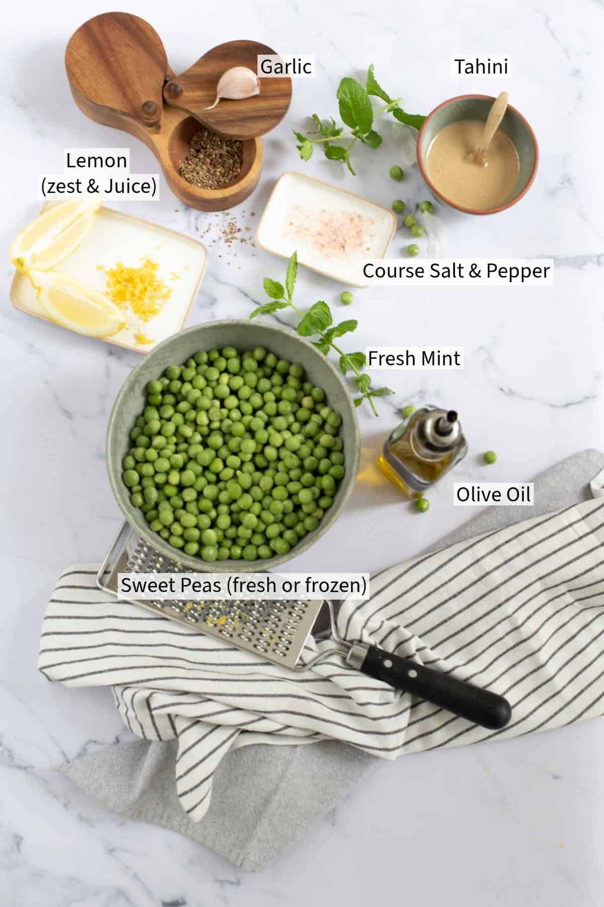 Ingredients for pea and mint dip laid out on a table and labelled. 