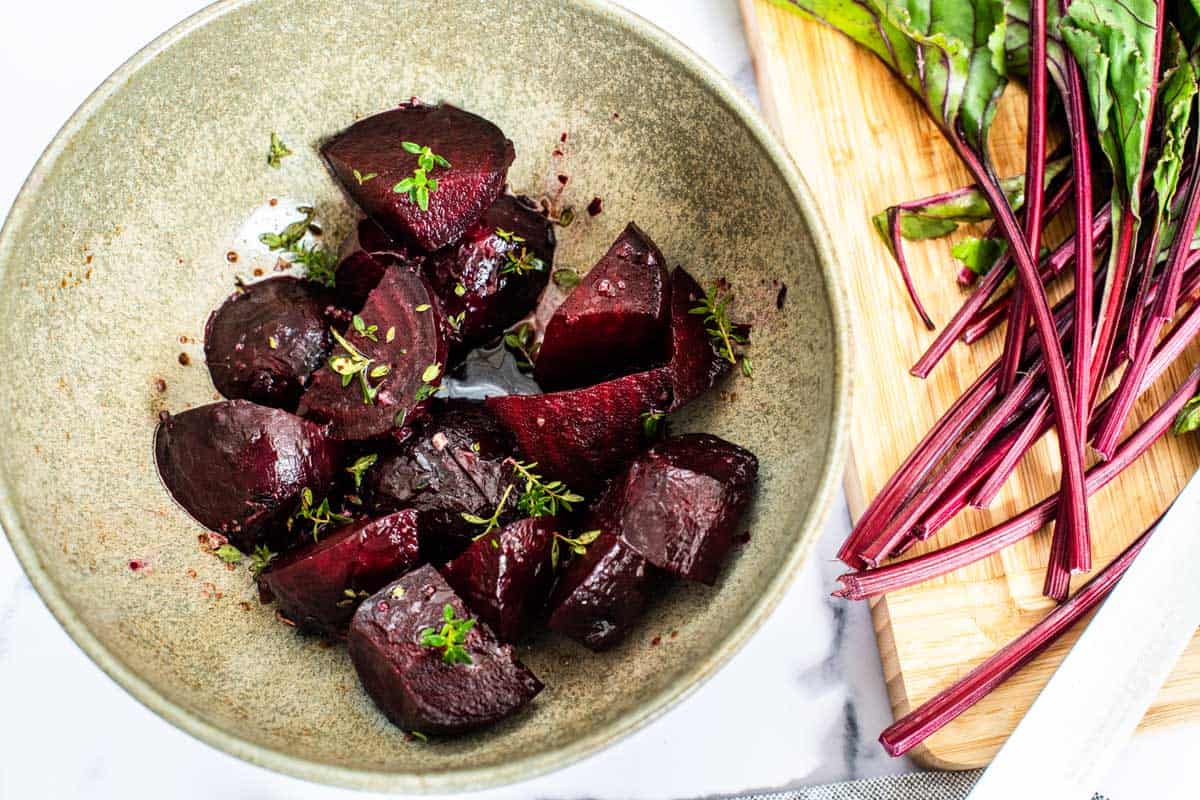 Bowl of roasted beets in balsamic dressing. 