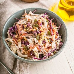Bowl of crunchy coleslaw on a table.