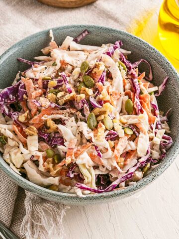 Bowl of crunchy coleslaw on a table.