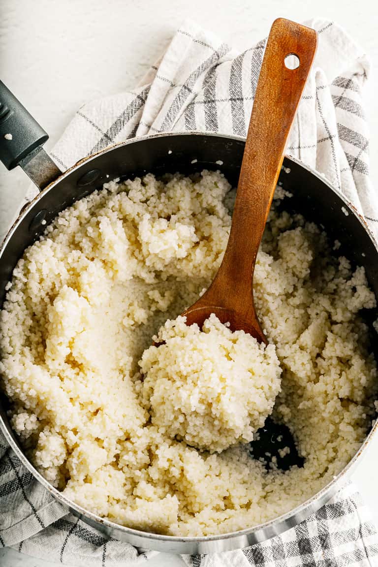 Saucepan with cooked couscous.