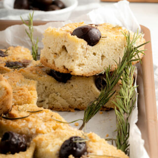 Slices of keto focaccia with olives and rosemary.