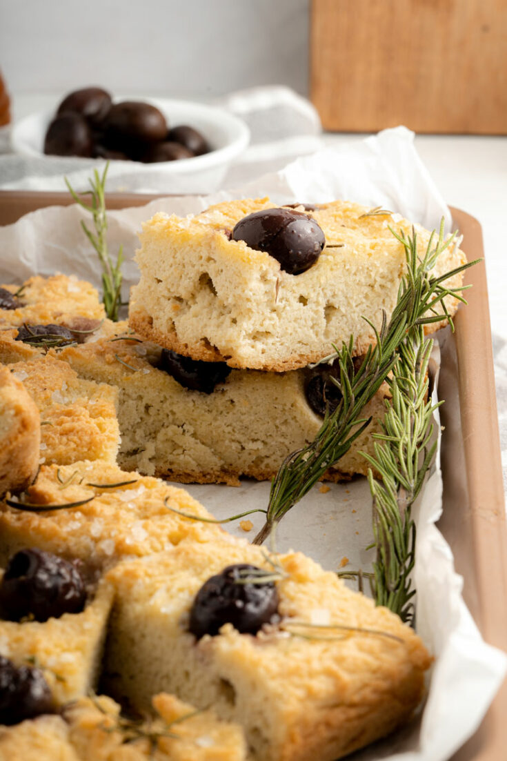 Slices of keto focaccia with olives and rosemary.