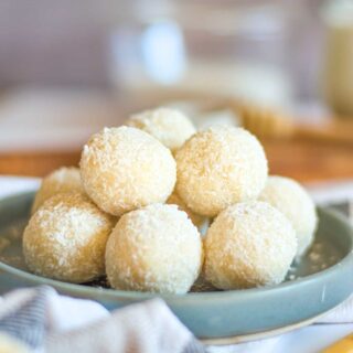 Plate of white coconut balls.