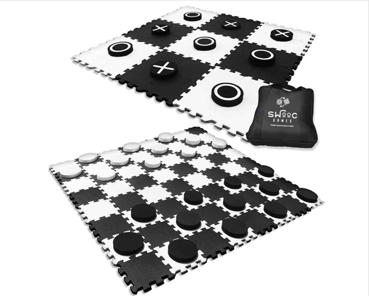 Large black and white reversible rubber checkers and tic tack toe playing mat. 