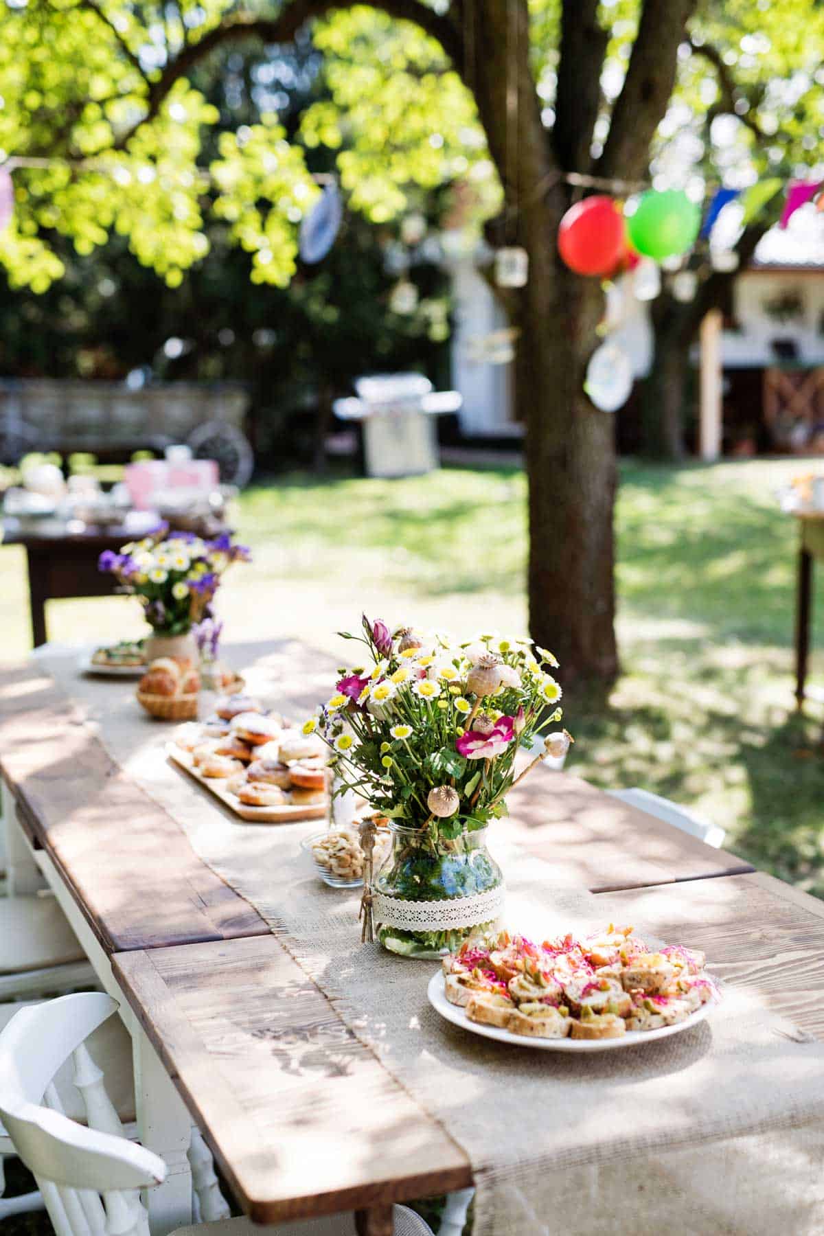 Table set for a garden picnic party celebration.