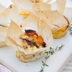 Mini pumpkin frittata with thyme on a plate.