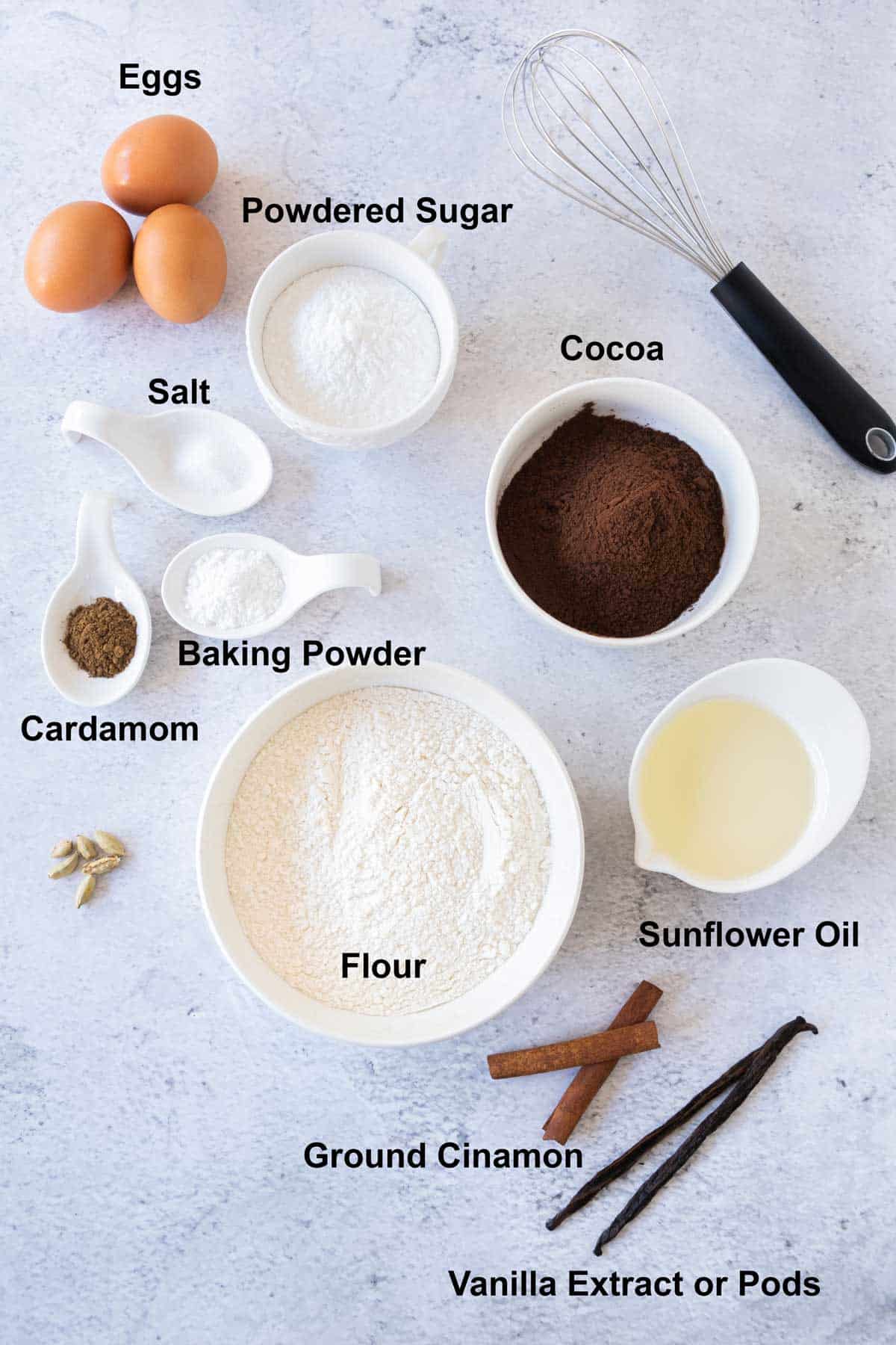 The ingredients for chocolate snowball cookies on a white background.