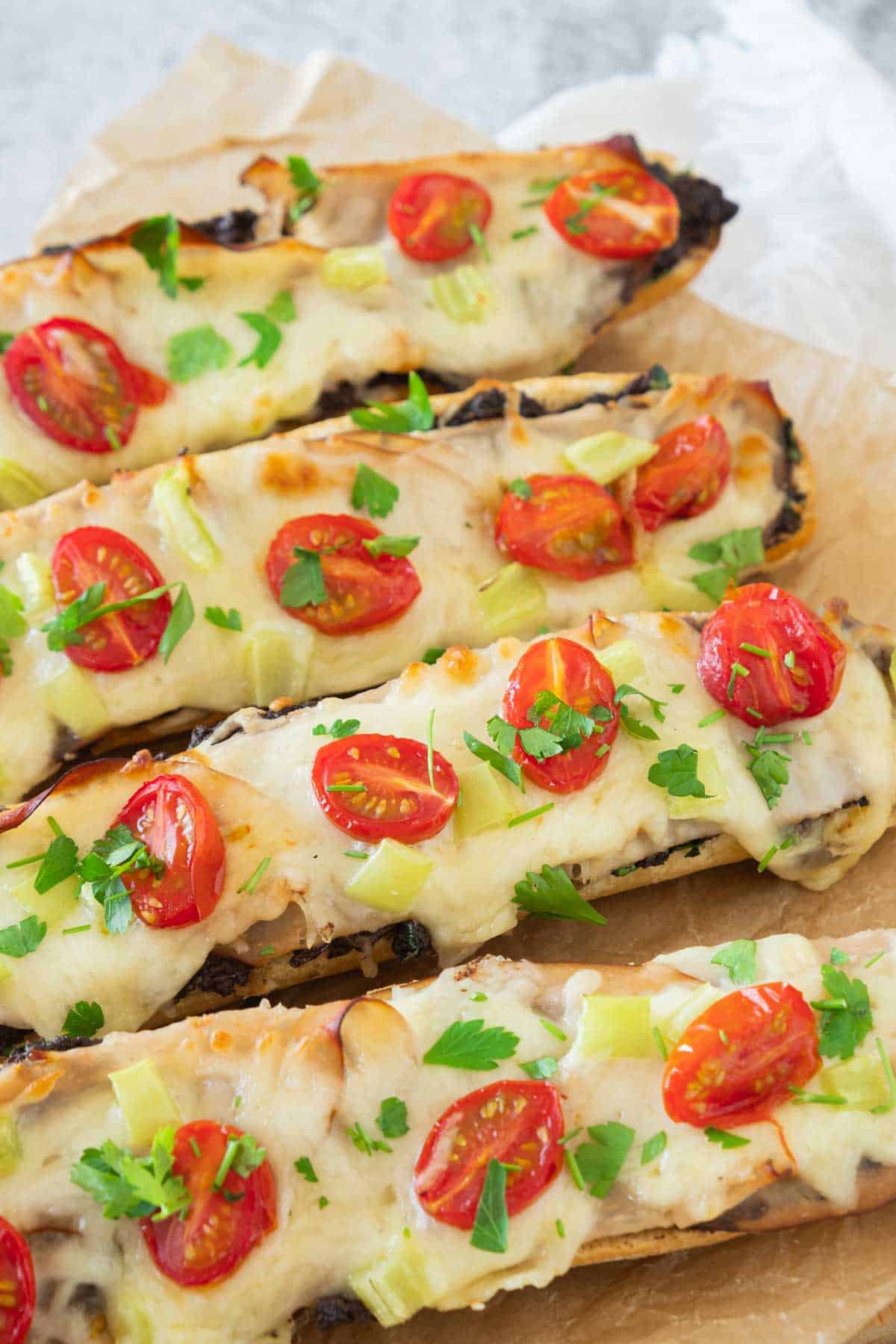 Cheese olive bread sticks with tomatoes and cheese.