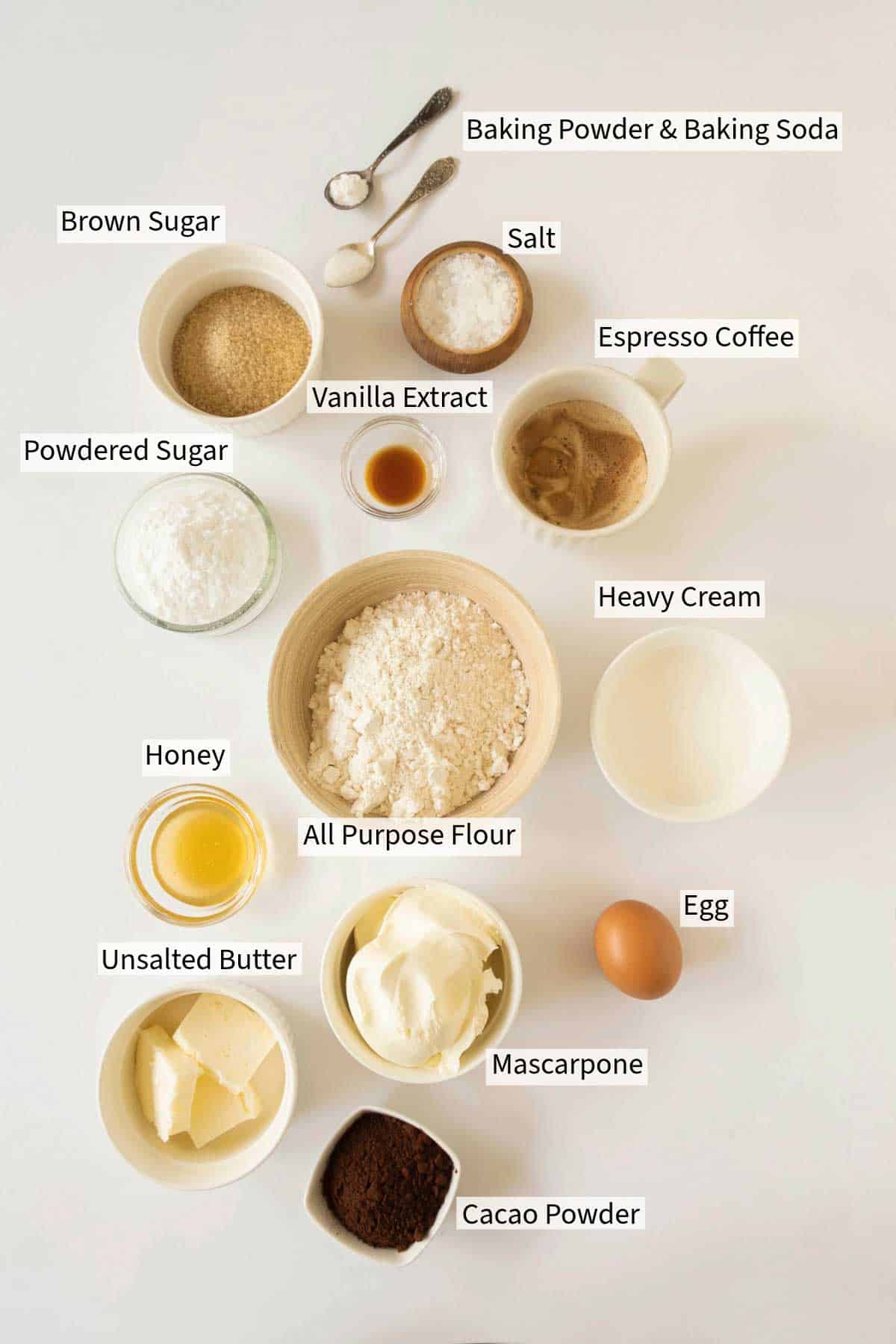 An overhead view of various baking ingredients for Tiramisu Cookies. The ingredients are labelled.